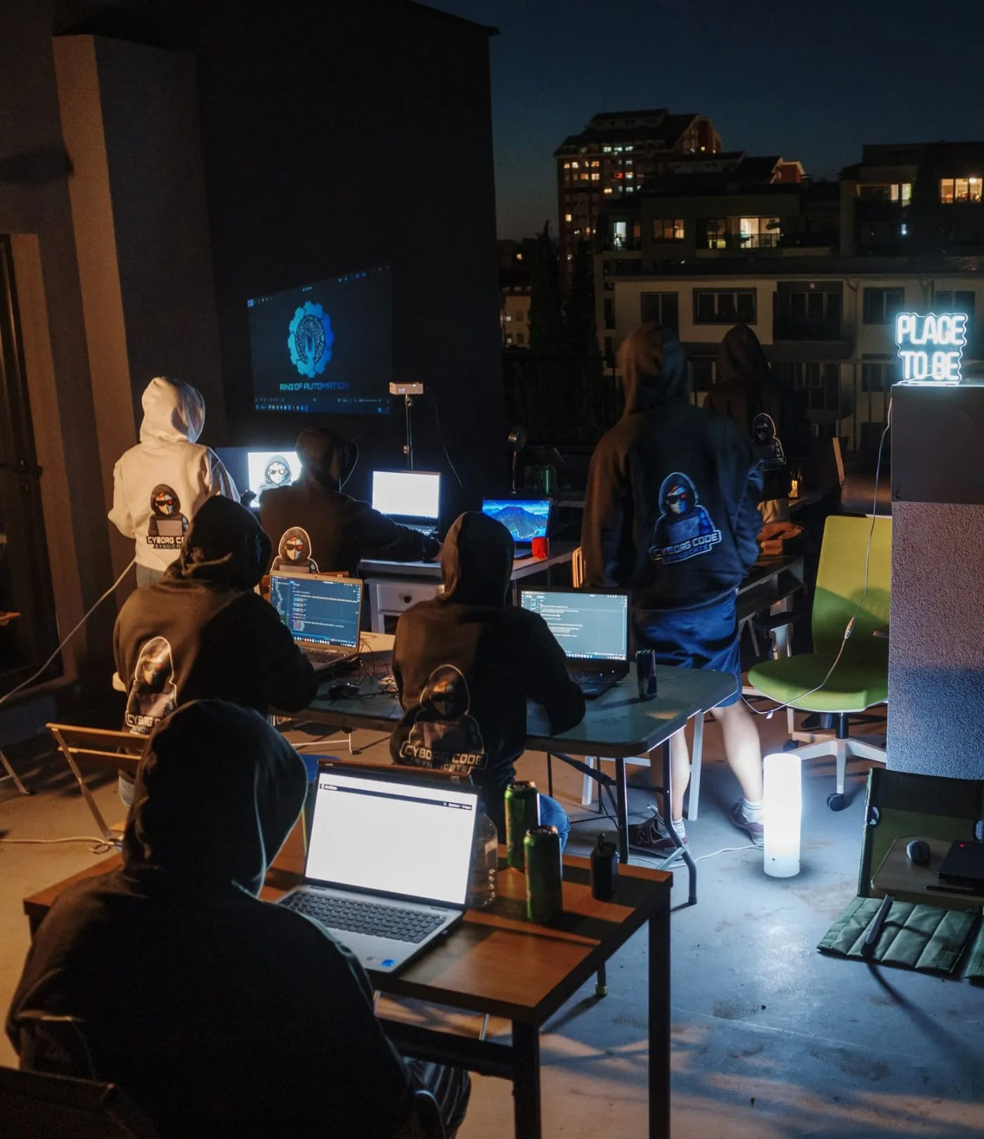 A rooftop hackathon at night